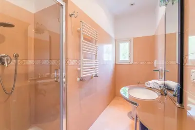 a bathroom with a shower and a sink at Elizabeth Penthouse, Charmy Apartment in Little London 10 Min From the Center in Rome