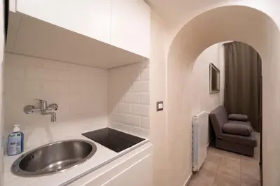 a bathroom with a sink and a chair at Popolo Pen 3 Apartament in Rome